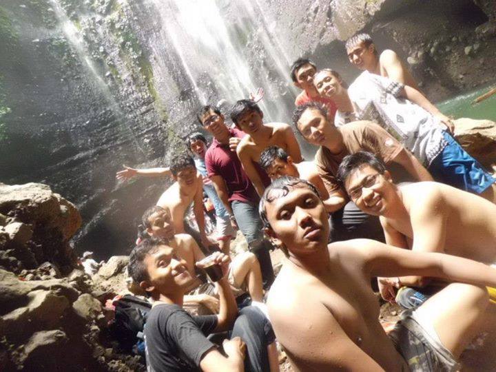 Group photo at waterfall edge