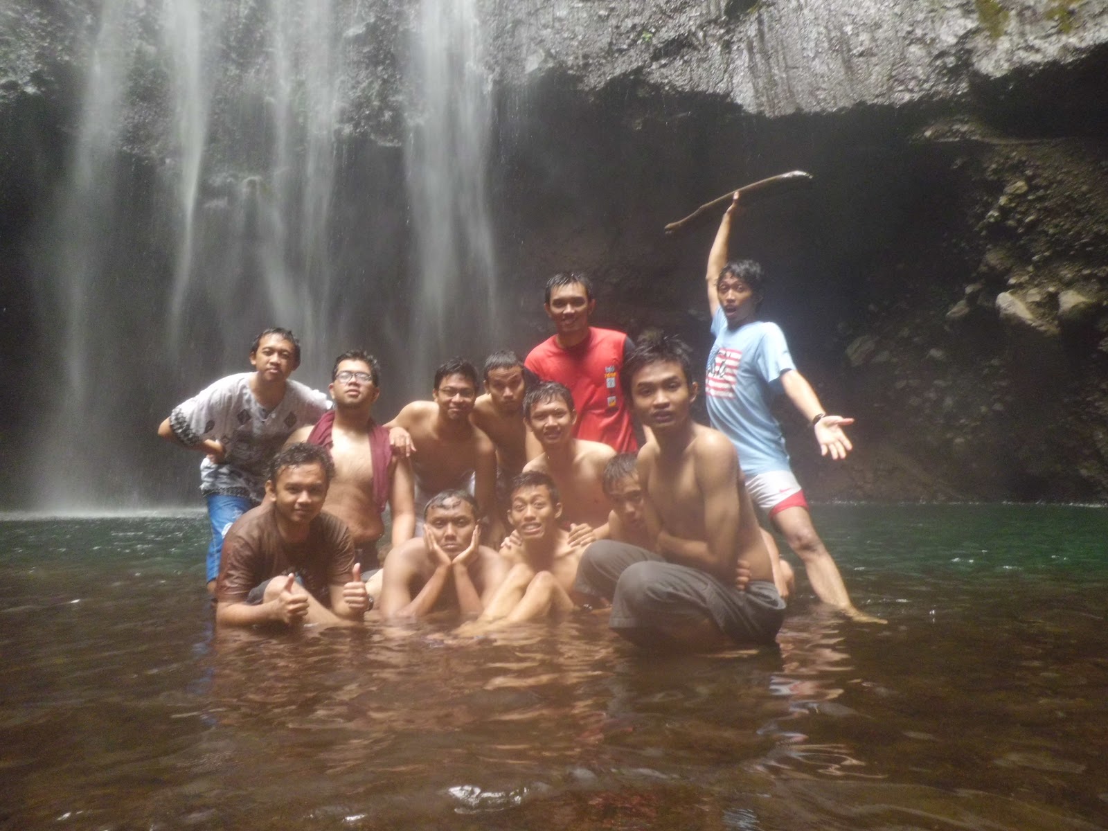 Group enjoying sacred pool Madakaripura